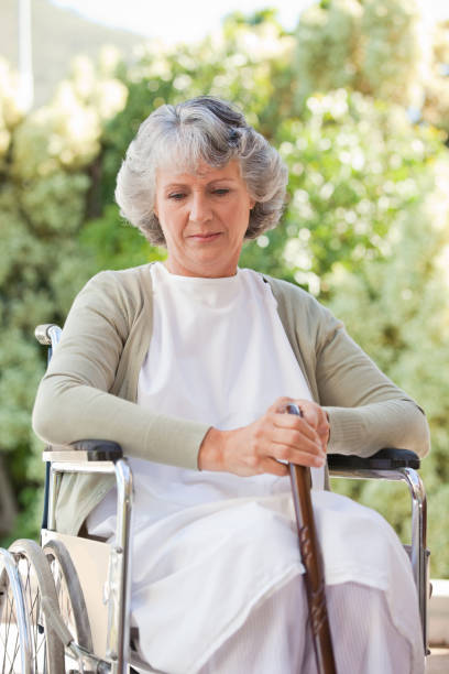 istock Retired woman with her walking stick 826304168