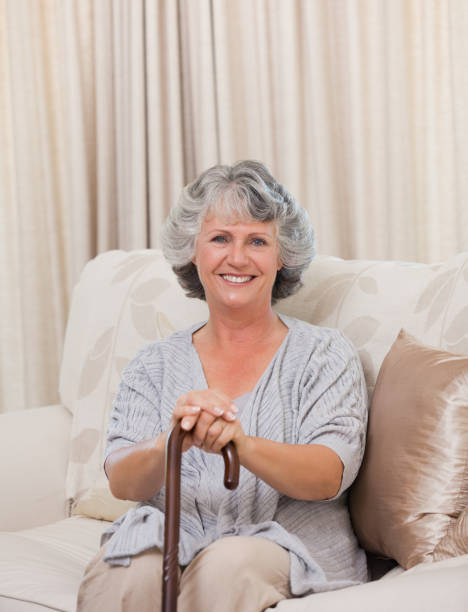 istock Woman with her walking stick 826304428