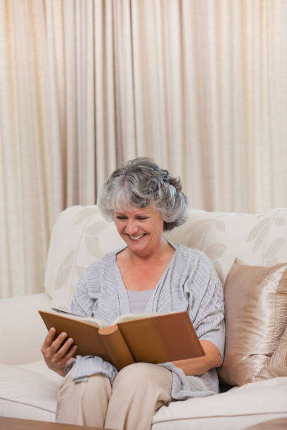 istock Senior looking at her photo album 826304902