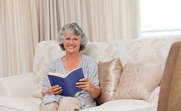 istock Senior woman reading her book 826305246