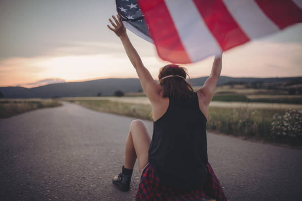 istock Woman skater with US flag 826307462