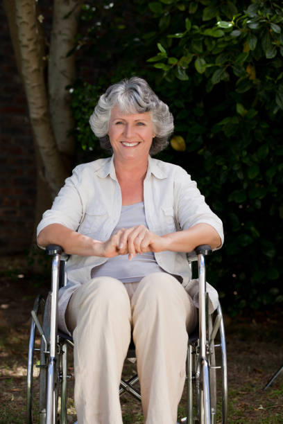 istock Smiling woman in her wheelchair 826307842