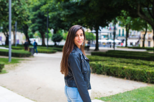 istock Young woman walking in the park 826308284