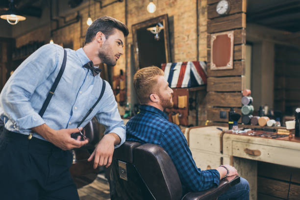 istock barber with customer in barber shop 826308958