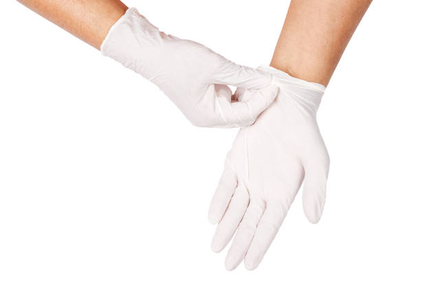 hand throwing away white disposable gloves medical - plucking an instrument imagens e fotografias de stock