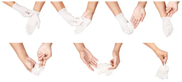 Step of hand throwing away white disposable gloves medical, Isolated on white background. Infection control concept.
