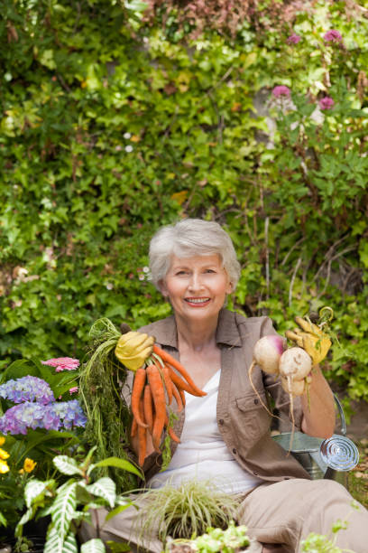 istock Retired woman working in the garden 826316964