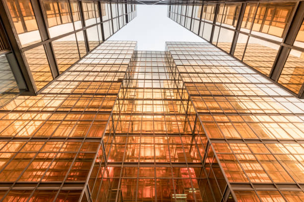 istock Gold colour office building tower facade  in business center 826324084