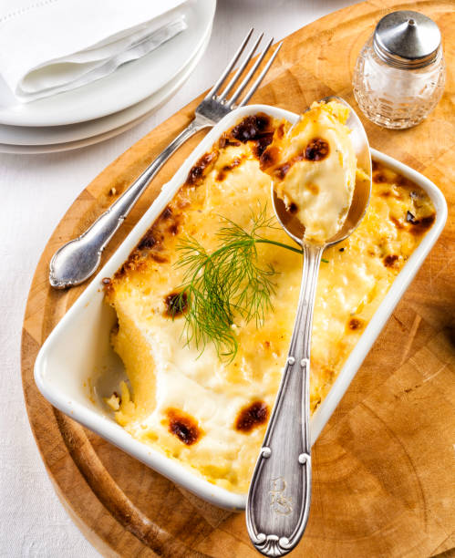 istock Cheese polenta in a tray. Romanian dish called balmos. 826336398