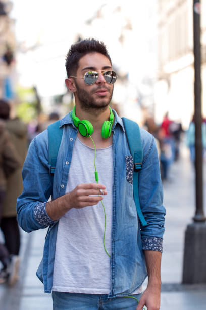 istock smoking young man with headphones and set the castle 826343590