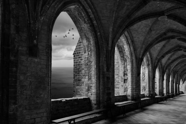 istock fantasy monastery archway with view to ocean an sunrays 826343722