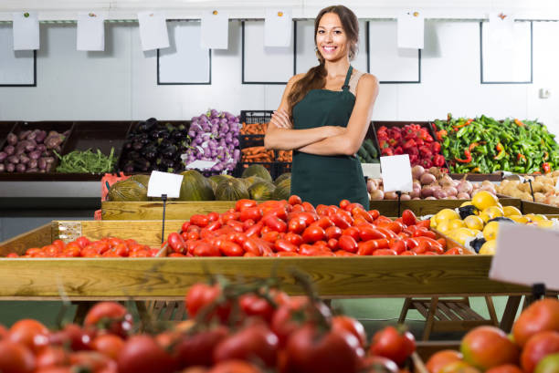 istock woman selling fresh tomatoes at market 826344498