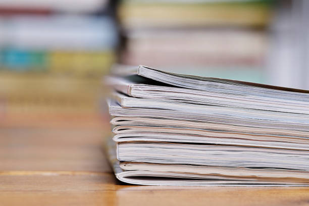istock Stack of magazine extreme close up with copy space 826358230