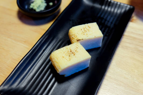 istock Sweet egg on black dish. Japanese food style 826358622