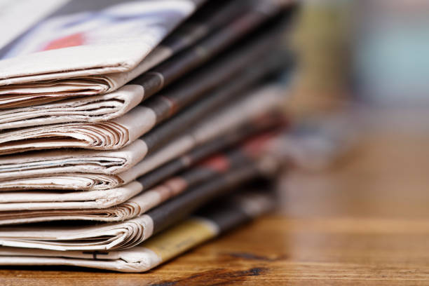 istock Stack of newspaper extreme close up with copy space 826359368
