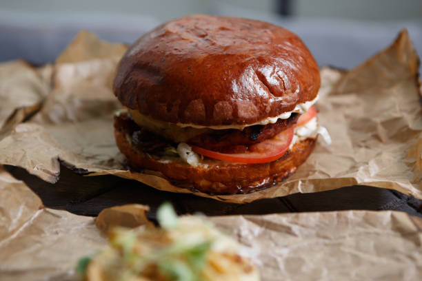 istock Tasty big burger served on plate in meat restaurant 826360286
