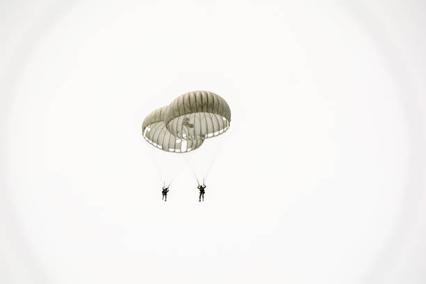 istock Parachute soldiers in the sky. 826362414