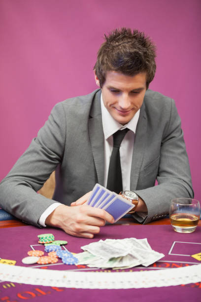 istock Man playing poker in a casino 826373236