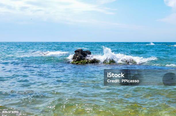 Coastal Waves Of The Black Sea Are Bumping Against A Protruding Stone From The Water Crimea 2017 Stock Photo - Download Image Now
