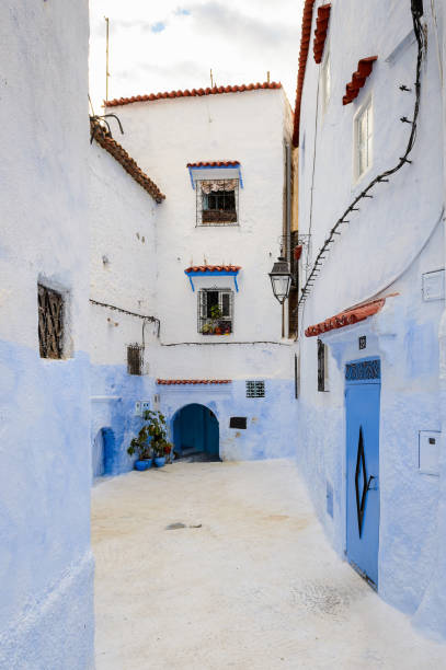 istock Blue walls street of Chefchaouen, Morocco. 826384708