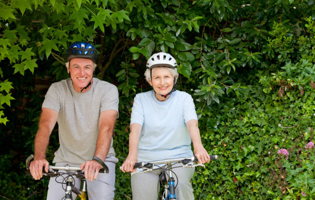 istock Senior couple mountain biking outside 826385634