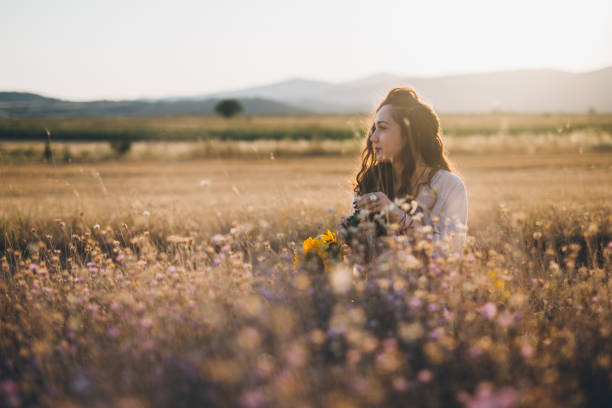istock Hipster woman blowing bubbles 826385866