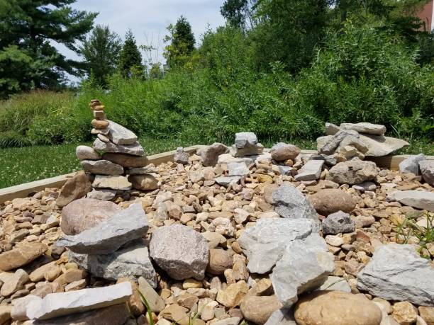 istock stacked stones in a wood square 826388334