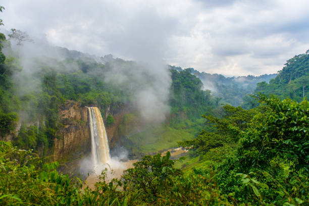 istock Water falls down out of the rock though the mist 826409458