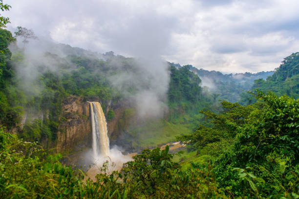 istock Water falls down out of the rock though the mist 826409612