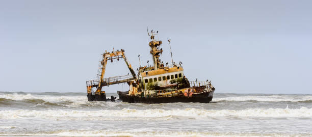istock Damaged abandoned ship at the coastline of Namibia 826419488