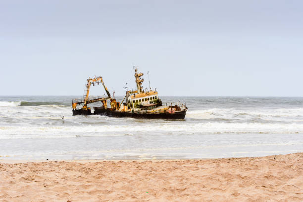 istock Damaged abandoned ship at the coastline of Namibia 826419532