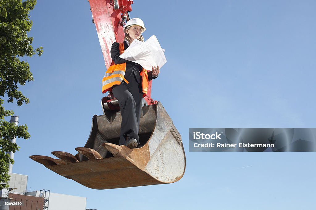 Business woman surveying construciton site  Construction Site Stock Photo