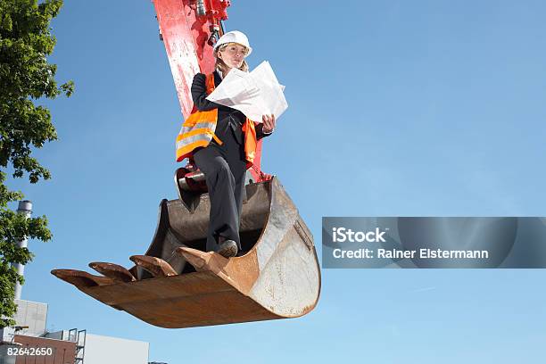 Business Woman Surveying Construciton Site Stock Photo - Download Image Now - Construction Site, Helmet, Backhoe
