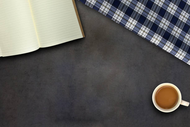 istock Book and coffee on black table, top view 826437380
