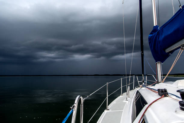 sailing concept with boat and lake water storm weather - buoy horizontal lake sailing imagens e fotografias de stock