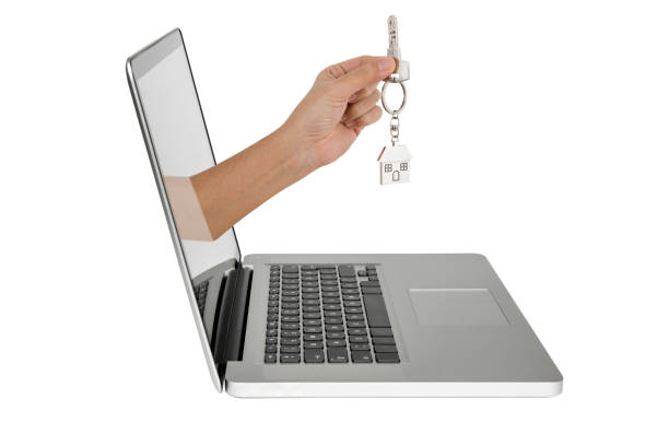 istock Human hand coming out from computer screen, Hand holding key 826448524