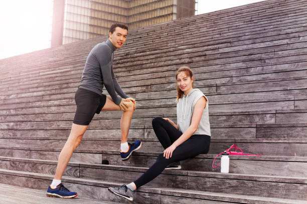 istock Young people warming-up together outdoors 826456276