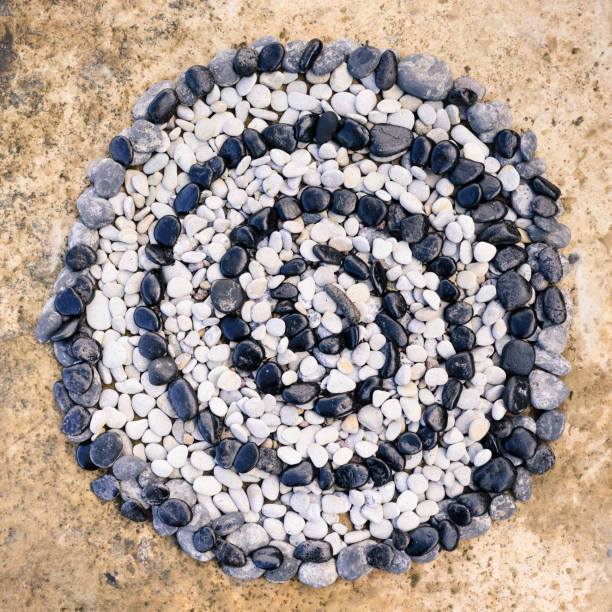 Sequence of black and white stones laid out in the form of a spiral