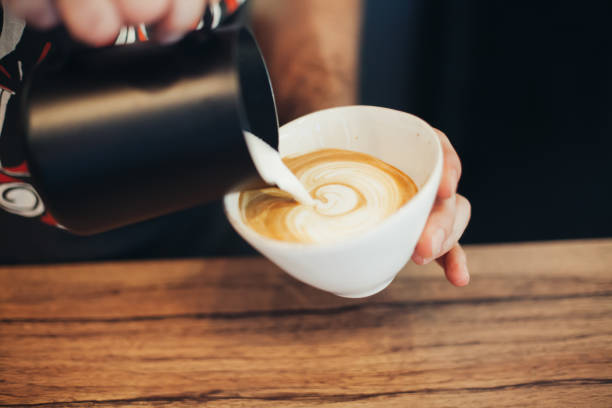 istock Barista Pouring Latte Froth Art 826464320