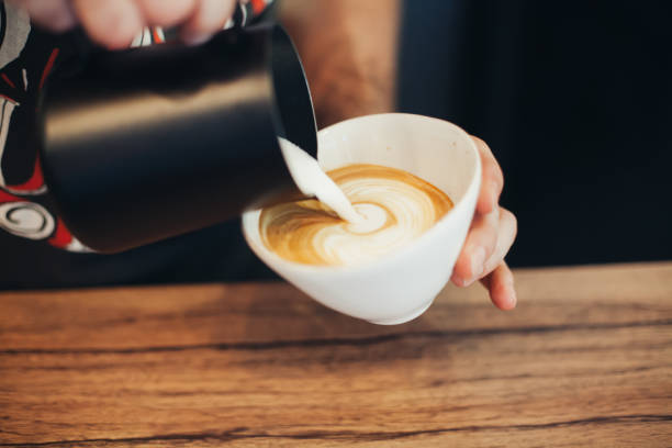 istock Barista Pouring Latte Froth Art 826464346
