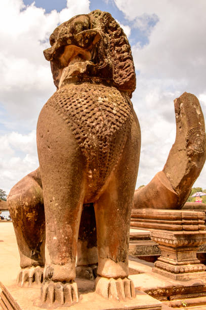 istock Statue near th eAngkor Wat (Temple City), the largest religious monument in the world. 826468660