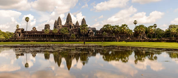 istock Angkor Wat (Temple City) and its reflection in the lake, a Buddhist, temple complex in Cambodia and the largest religious monument in the world. View from the garden 826468950