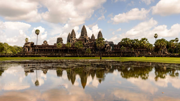 istock Angkor Wat (Temple City) and its reflection in the lake, a Buddhist, temple complex in Cambodia and the largest religious monument in the world. View from the garden 826468982