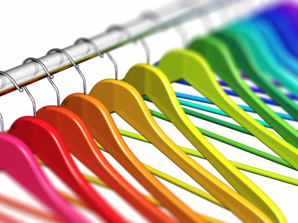 istock Rainbow coat hangers on clothes rail 826471294