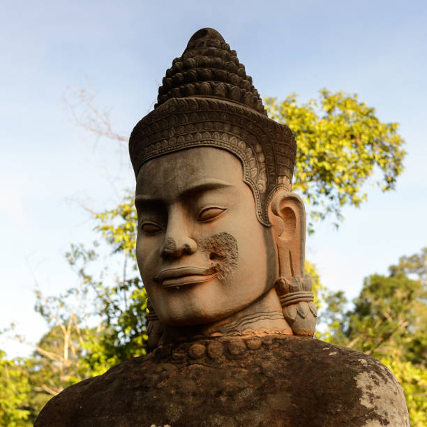 istock Figure near the Angkor Thom, Cambodia. Khmer temples complex 826474848