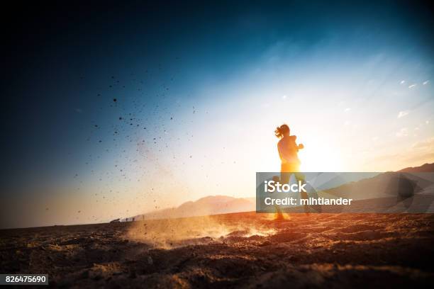 Woman Runs On The Desert Stock Photo - Download Image Now - Running, Marathon, Women