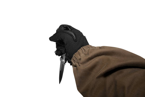 istock Isolated soldier arm holding knife. 826482294