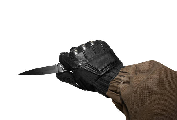 istock Isolated soldier arm holding tactical knife. 826482316