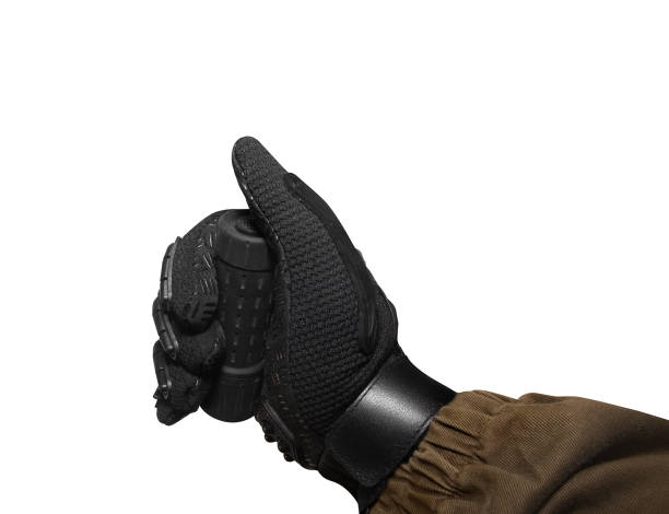 istock Isolated soldier arm holding hand remote. 826482324
