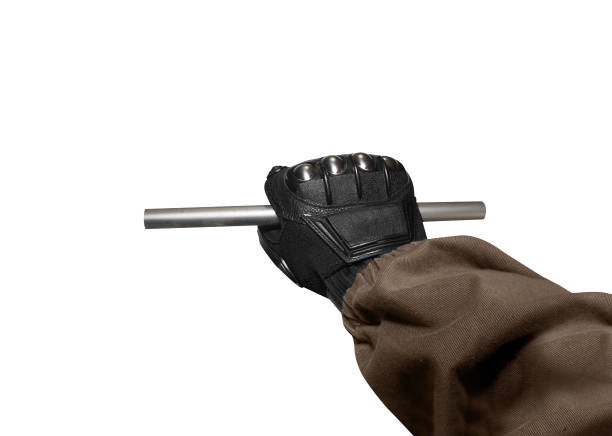 istock Isolated soldier arm holding metal stick. 826482334